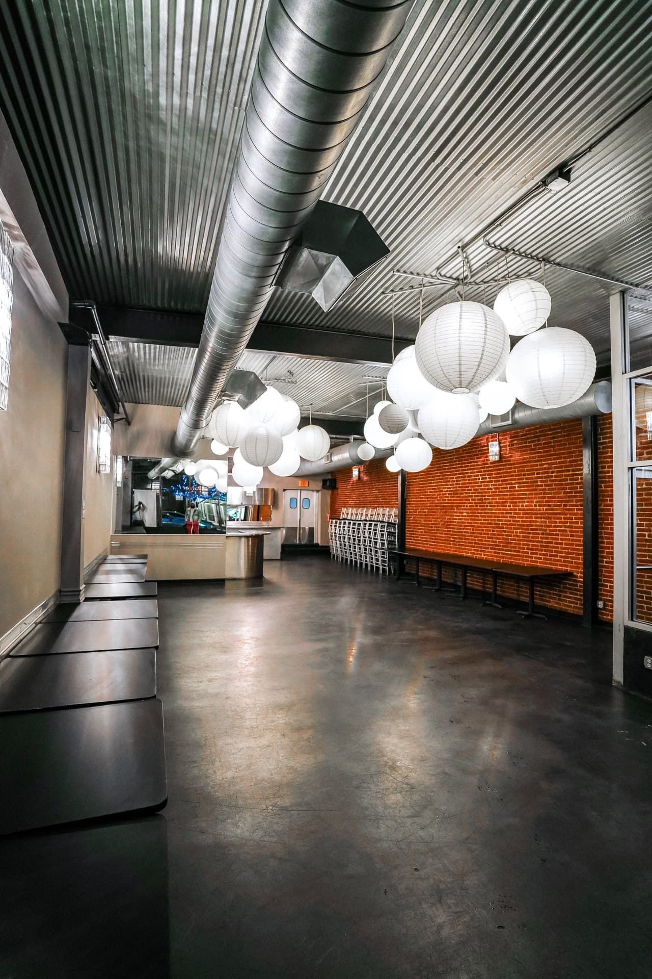The original Social Space venue with paper lanterns and exposed brick