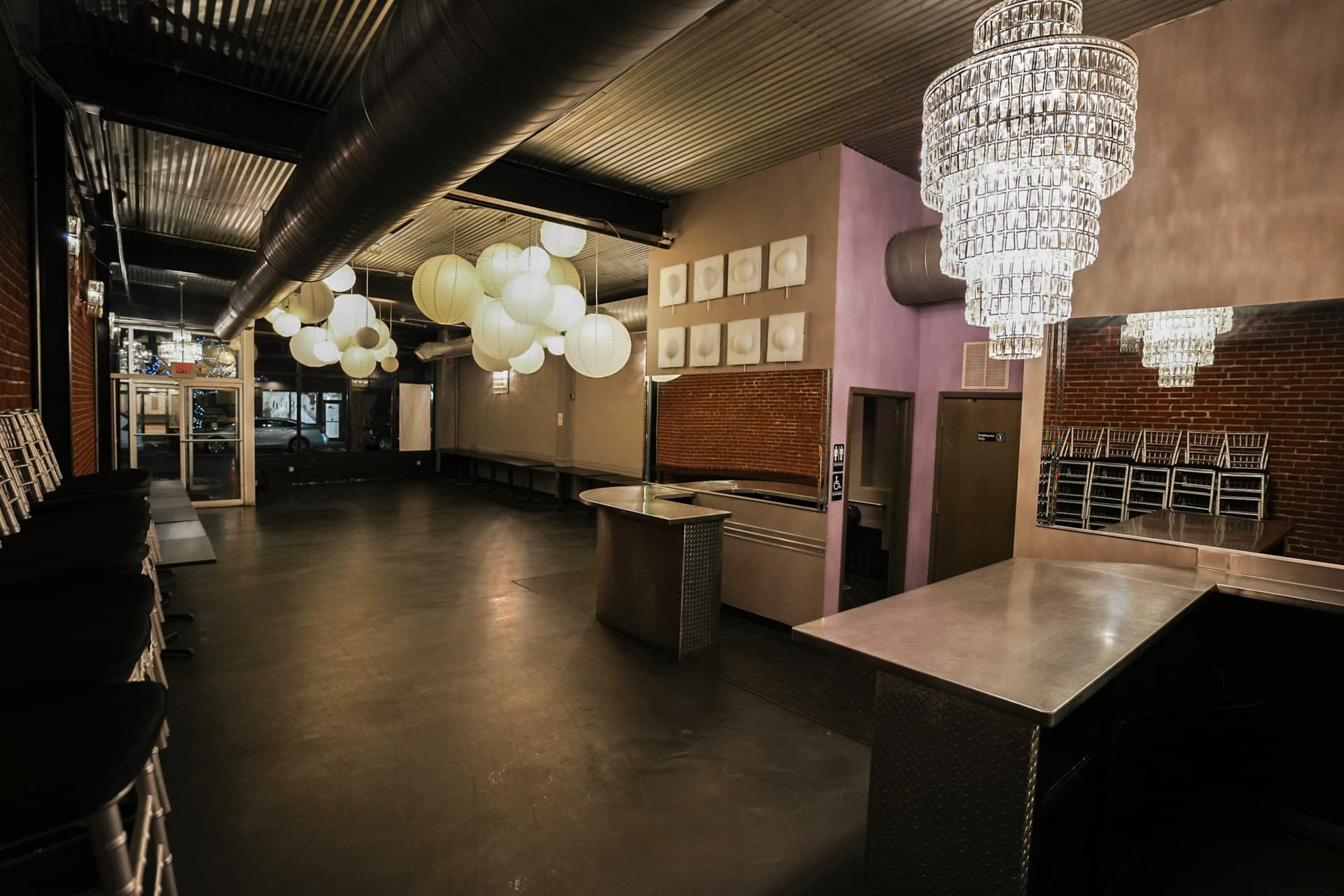 Inside the original Social Space venue — paper lanterns, chandelier, and bar